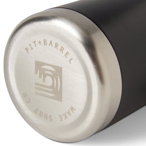 Bottom view of insulated drink holder in black featuring 'Pit + Barrel Wake Surf Co.' text with curling wave logo. 
