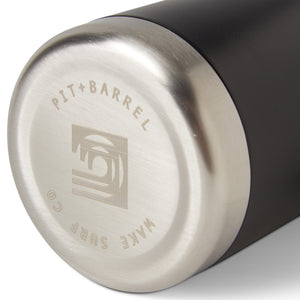 Black |  Bottom view of insulated drink holder in black featuring 'Pit + Barrel Wake Surf Co.' text with curling wave logo. 