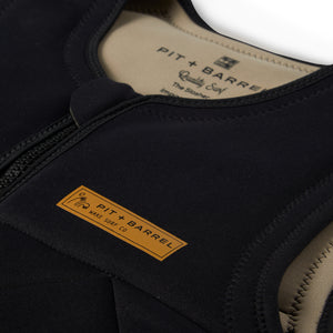 Detail view of black competition impact wake surf vest, inside color is tan with minimal badging. 