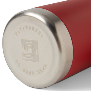 Brick | Close-up of a red and silver container with 'Pit + Barrel' branding on a white background