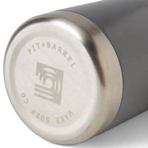 Grey | Close-up of a gray and silver container with 'Pit + Barrel' branding on a white background