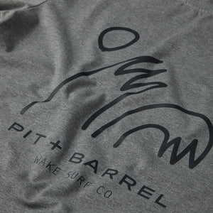 detail view of grey t-shirt with 'Pit+Barrel' logo with fun high five wave logo. 