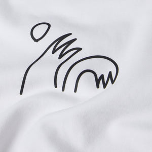 Detail View of a White t-shirt with a small black "high five" barreling wave graphic on a white background