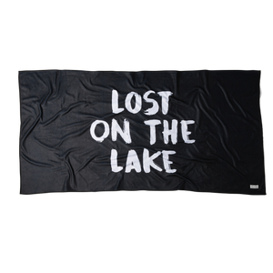 Front view of Black Microfiber towel laid out with text saying 'Lost on the Lake'. 