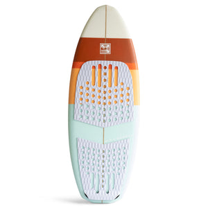 Top view of retro colored wake surf board with 3 fins and curling wave logo  showcasing the white traction pad that is in two pieces. 