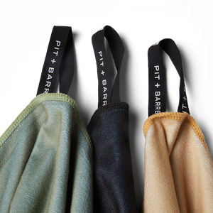 Detail image of Microfiber towels hanging by the minimalistic tag hook. Detail of stitching show great quality. 