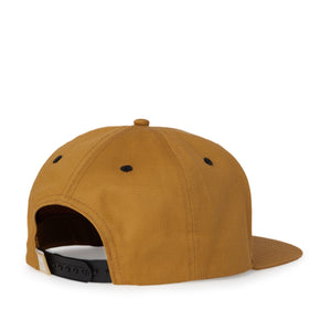 Tan 6 panel cap with curling wave tag black snap closure back view
