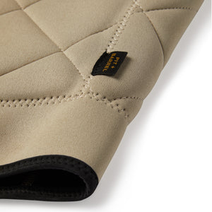 | Tan Tan competition impact vest detail image of simple tag and stitching. 